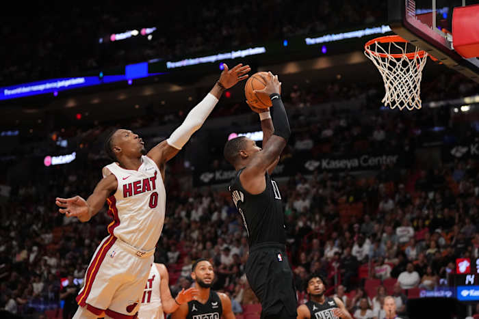 Brooklyn Nets guard Lonnie Walker IV (8) shoots the ball against Miami Heat guard Josh Richardson (0)